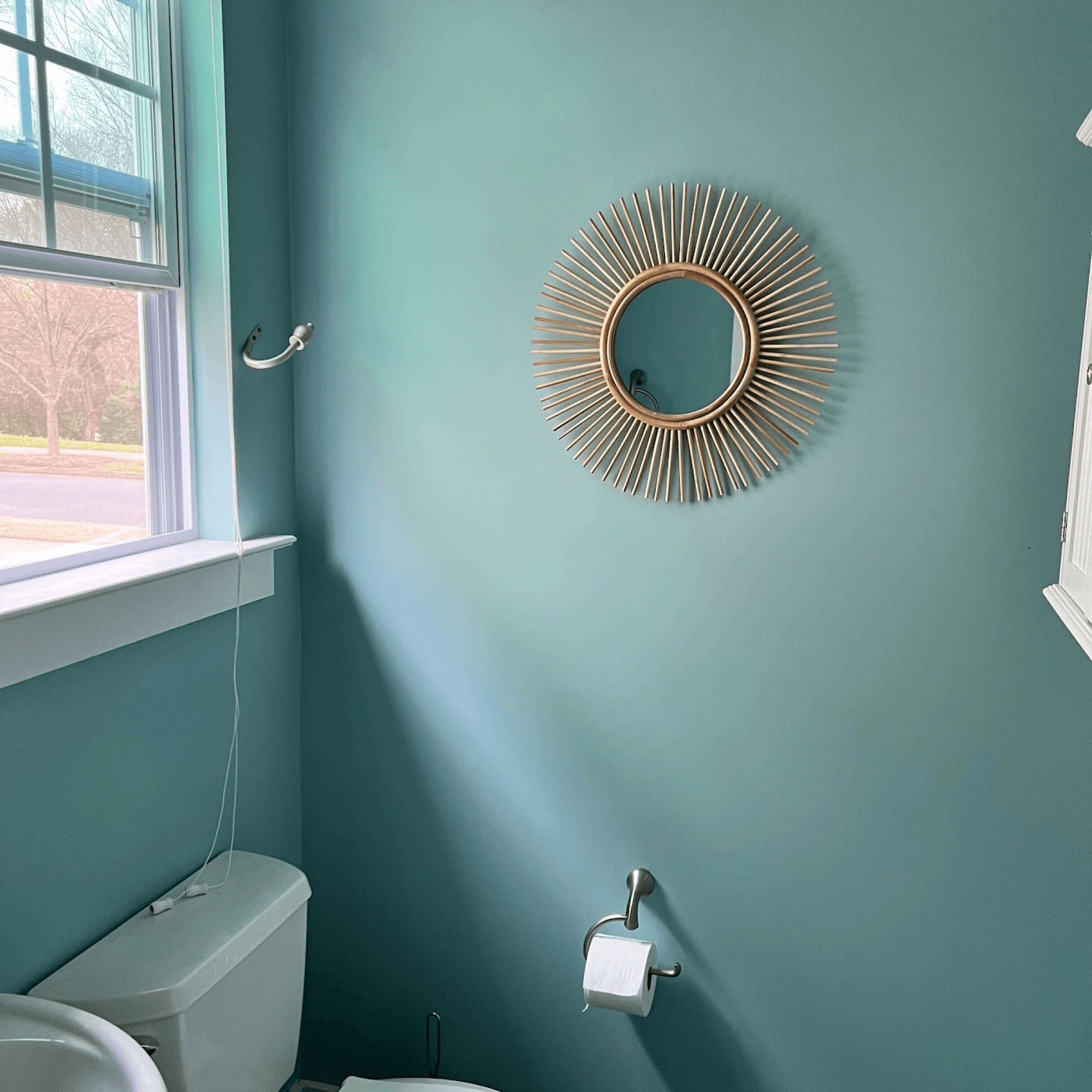 Craftwork painted a customer's bathroom walls in Sherwin-Williams Aquaverde (SW 9051).
