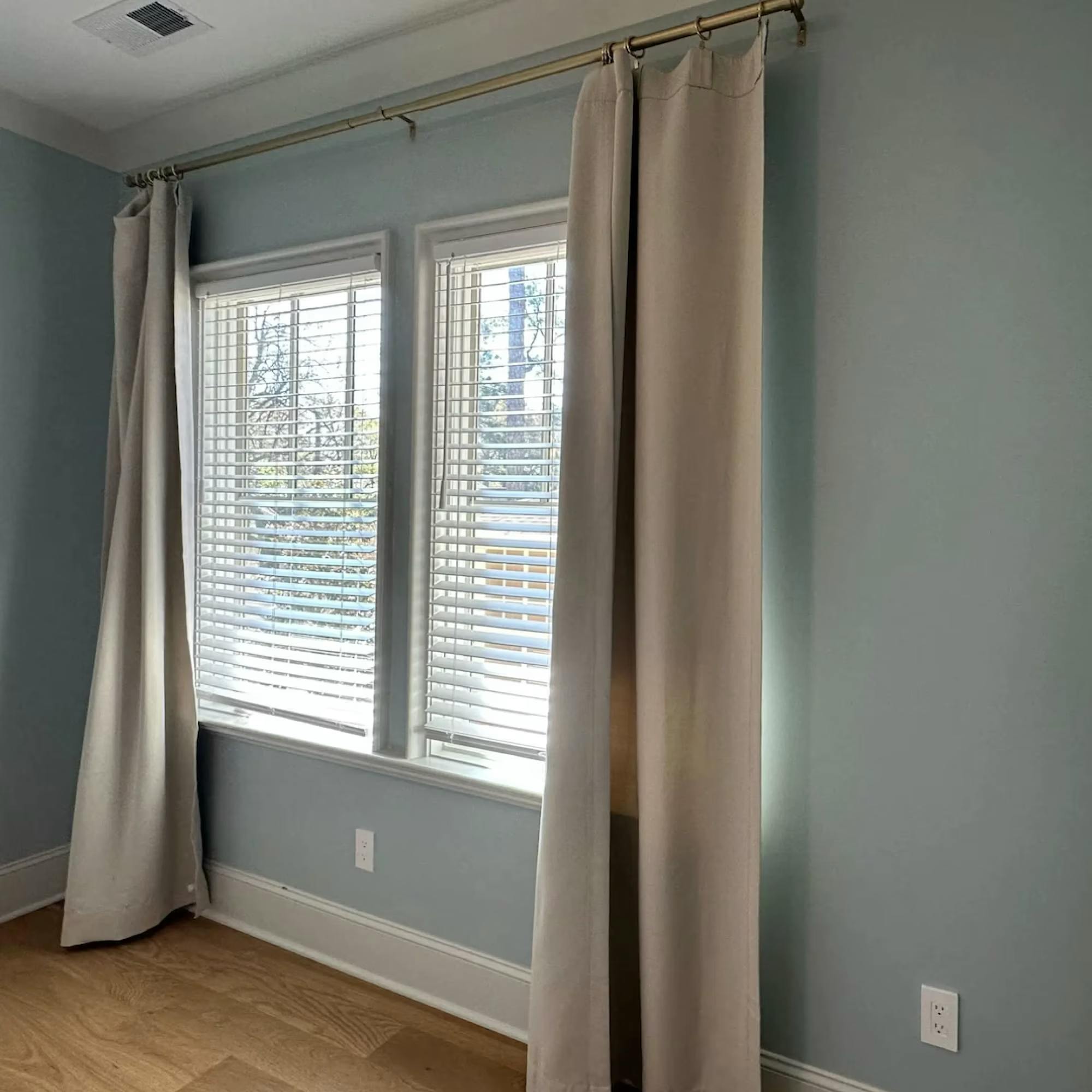 Craftwork painted a second bedroom in Plaza Midwood Sherwin-William’s Tradewind (SW 6218).